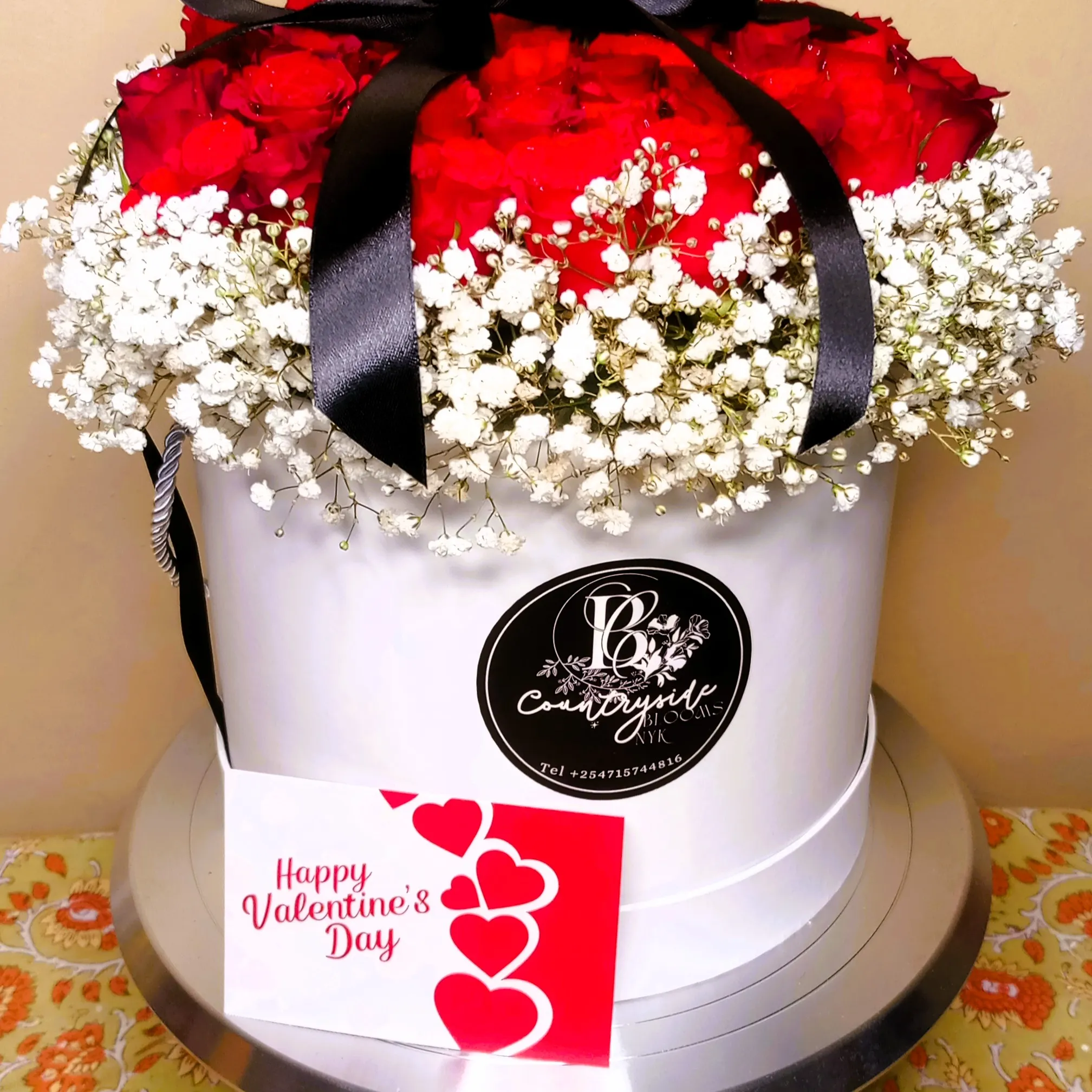 Elegant floral white chocolate cake with edible flowers